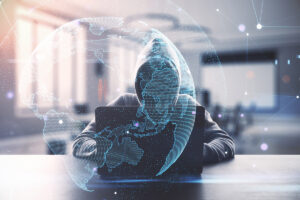 Cybersecurity in South Africa highlighted by hacker on laptop