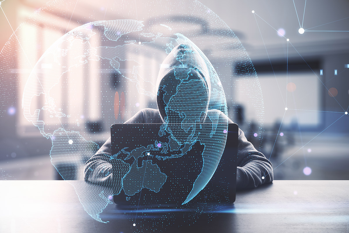 Cybersecurity in South Africa highlighted by hacker on laptop